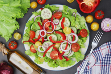 A plate full of bright fresh vegetable salad