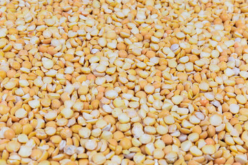 Yellow split peas close-up in selective focus
