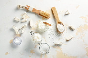 Composition with coconut body scrub on light background