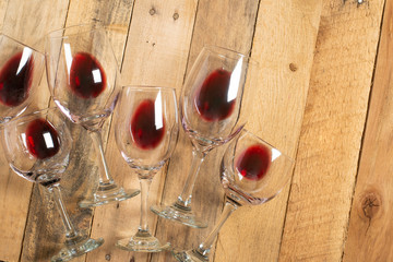 Flat lay red wine in glasses on wooden background with space, Concept of wine distillation, winery,...