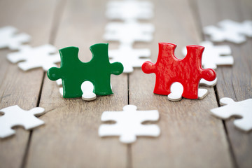 piece of jigsaw puzzle On the old wood . teamwork concept.  symbol of association and connection. business strategy.