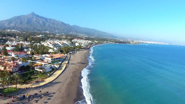 flying over marbella coastline, perfect view of beach sea and mountain (la concha). 
perfect clip for holiday vacation videos or retirement luxury life