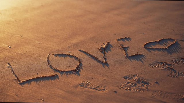 The inscription on the sandy beach
