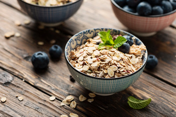 Mix of homemade cereal with blueberry and mint