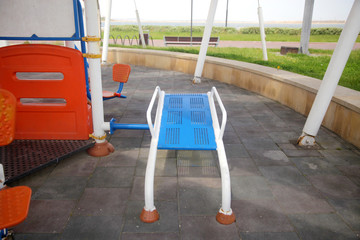 Exercise equipment in a public park in a sunny day
