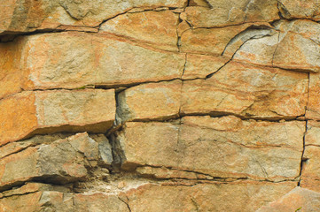 background of red granite canyon. Close-up of granite background
