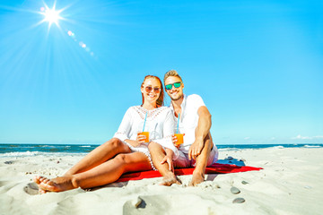 Young people on beach and free space for your decoration. 