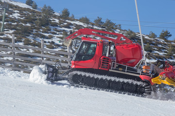 Red snow caterpillar vehicle side view