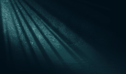 Empty scene background. Incident light from a window on an empty brick wall. Dark abstract background