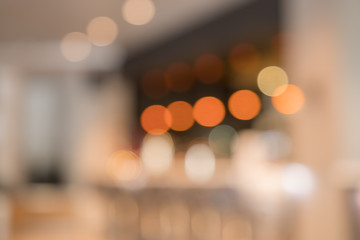 Blurry image of a cafe interrior background with bokeh