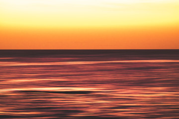 Fototapeta premium Artistic view of ocean sea water in long exposure in motion - background and coulours for nature concept - outdoors holiday vacation