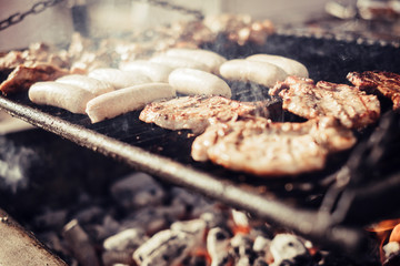 Close up of barbecue meat grill with fire and carbon . delicious food to eta in friendship celebration outdoor