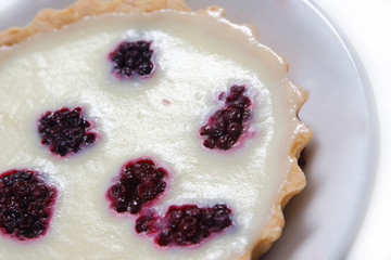 Lemon pie with puff pastry and blackberry.