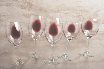 Red wine in transparent wine glasses on a betton background. Bojole nouveau, wine bar, winery, winemaking, wine tasting concept, Flat lay