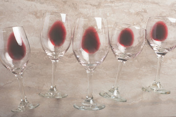 Red wine in transparent wine glasses on a betton background. Bojole nouveau, wine bar, winery,...