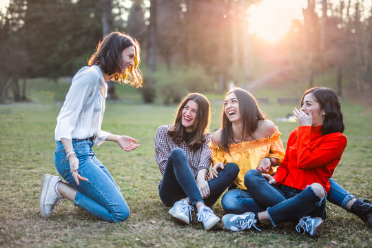 group of friends having fun in park
