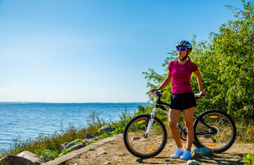 Fototapeta premium Young woman cycling