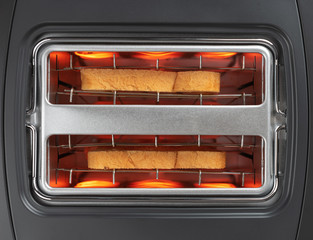 Bread toasted in toaster top view, close up