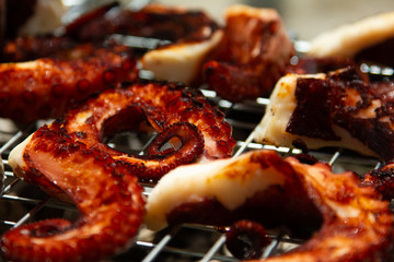 cooking fresh grilled octopus and fish