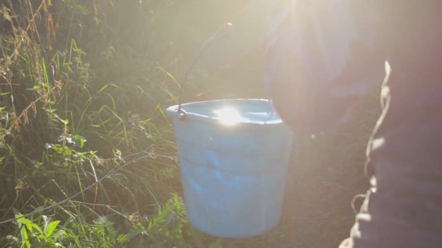 Well water in buckets in smooth cinematic motion