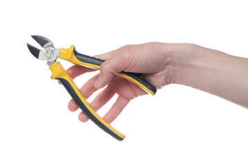 Man's hand holding a black and yellow wire cutter. Open, clean, ready to cut form.