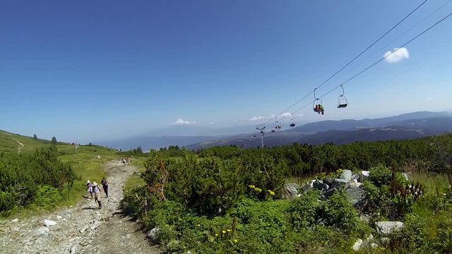 Mountaineers walking  true the mountains in Bulgaria(Rila musala). Filming with gopro beautiful nature and peoples walking around,tracking and enjoying the life doing sports.