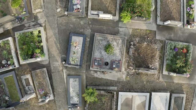 Cinematic Footage of Graveyard near the local Church. Very scary Cemetery with dark history. Filmed with a drone with bird eye view perspective. Filming in 4k very stable.