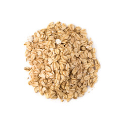 Top view of raw oat flakes pile. Oatmeal isolated on white background