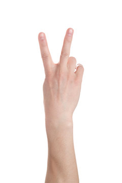 Man showing number two on white background, closeup. male hand shows a "peace" sign isolated on white background. .