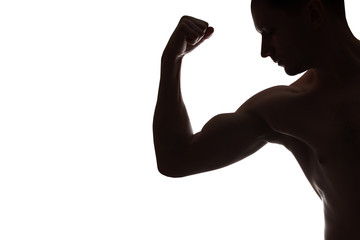 Fototapeta na wymiar Young Muscular bodybuilder demonstrates his bicep on white background