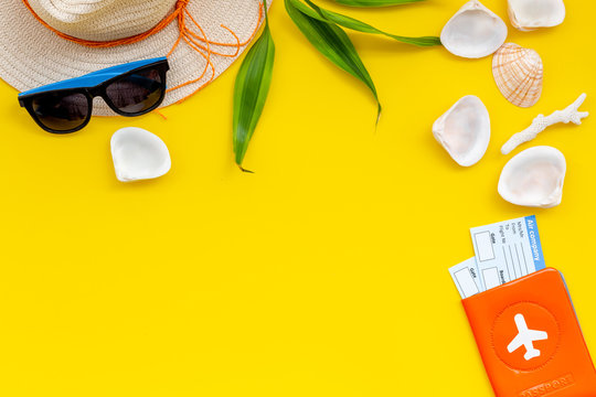 Summer Travaling To The Sea With Straw Hat, Sun Glasses, Tickets And Passport On Yellow Background Top View Mock Up