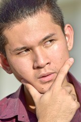 Obraz premium Thoughtful Handsome Asian Male