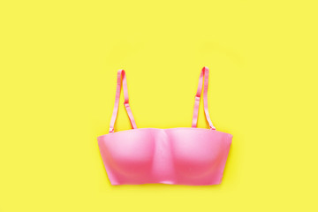 Beautiful Pink Underwear Isolated on Yellow Color Pastel for Valentine is Day. Set of Accessory...