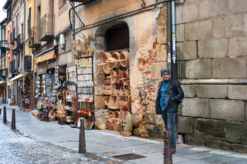 Tourist walking in front of souvenir shops at Segovia the historic city Romanesque architecture locate at northwest of Madrid, Spain.