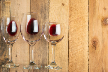 Flat lay red wine in glasses on wooden background with space, Concept of wine distillation, winery, winery, wine bar, party