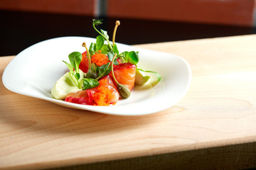 Smoked Salmon Salad on wooden background