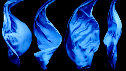 Smooth elegant blue transparent cloth isolated on black background.
