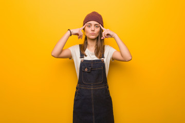 Young hipster woman doing a concentration gesture