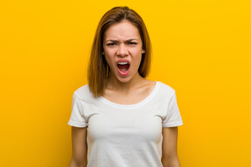 Fototapeta premium Young natural caucasian woman screaming very angry and aggressive.