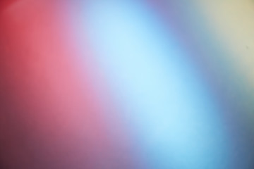 Rays of light in pink, blue and yellow