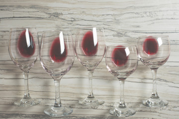 Flat lay background with glasses with red wine on betton background, Concept of winegrowing, winery, winery, wine bar, party