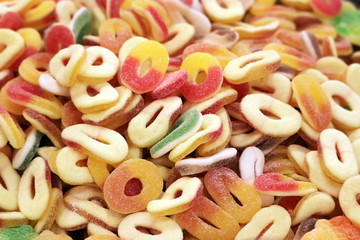 Sour gummy rings, colorful candy. Multi colored chewing marmalade for background