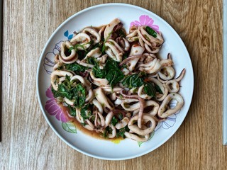 Stir fried squid basil on a holiday breakfast.