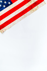 Fototapeta na wymiar USA national day background with flag on white desk top view copy space