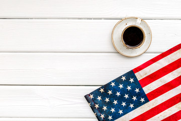Independence day of USA with flag and cup of coffee on white wooden background top view space for text