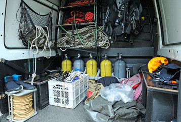 Part of a rescue mobile post with a diving equipment set: balloons, wetsuits, buoys, bags