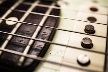 Details of electric guitar with macro dark background