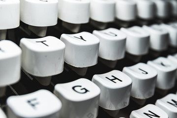 Typewriter characters whites details macro icon and letters on retro machine keyboard