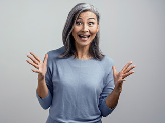 Beautiful mature woman posing in studio