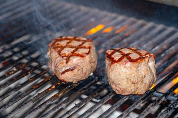 Delicious beef steaks, the hot barbecue grill.